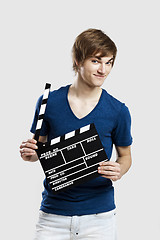 Image showing Holding a clapboard