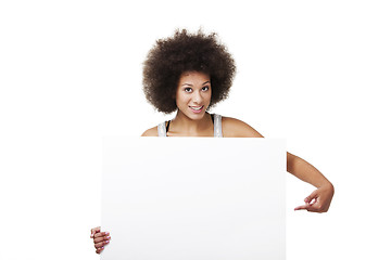 Image showing Woman holding a white billboard