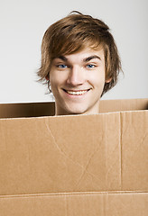 Image showing Man inside a card box