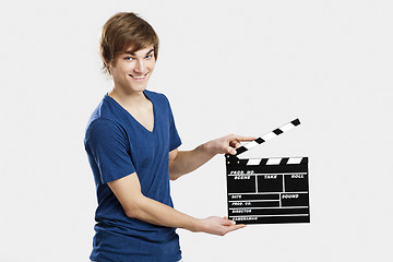 Image showing Holding a clapboard