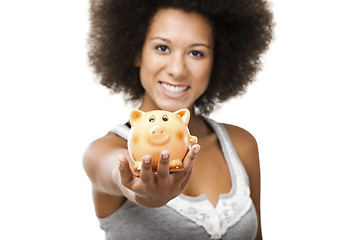 Image showing Woman with a piggy bank