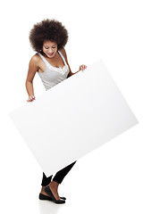 Image showing Woman holding a white billboard