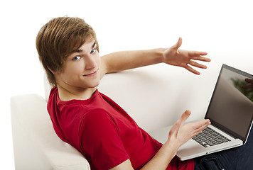 Image showing Young man with a laptop