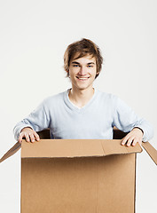 Image showing Man inside a card box