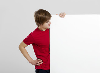 Image showing Man holding a cardboard