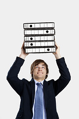 Image showing Business man carrying folders