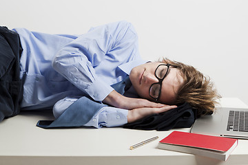 Image showing Sleeping in the office