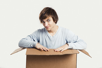 Image showing Man inside a card box