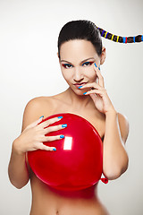 Image showing Fashion woman with a red balloon