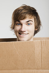 Image showing Man inside a card box