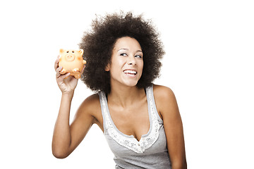 Image showing Woman with a piggy bank