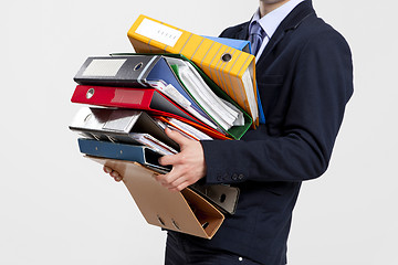 Image showing Business man carrying folders