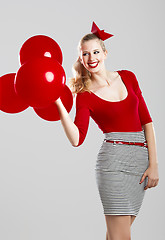 Image showing Woman with red ballons