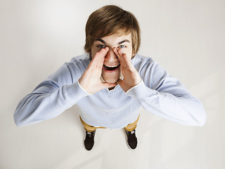 Image showing Young man shouting