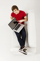 Image showing Young man with a laptop