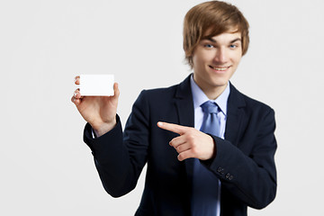 Image showing Businessman holding a business card