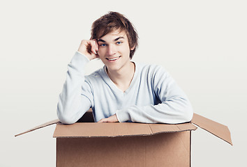 Image showing Man inside a card box