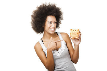 Image showing Woman with a piggy bank