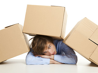 Image showing Man under boxes