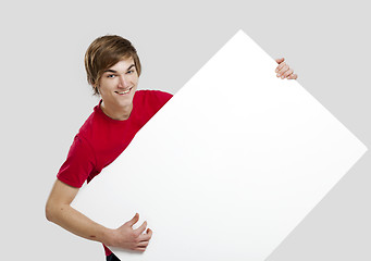 Image showing Man holding a cardboard