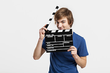 Image showing Holding a clapboard