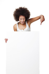 Image showing Woman holding a white billboard