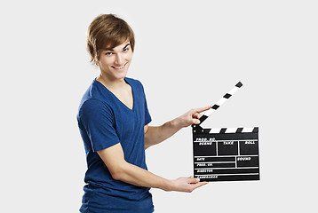 Image showing Holding a clapboard