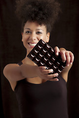 Image showing Woman with a chocolate bar