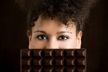 Image showing Woman with a chocolate bar