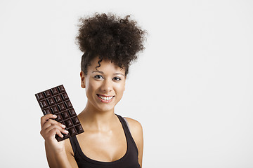 Image showing Woman with a chocolate bar