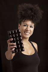 Image showing Woman with a chocolate bar