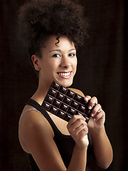 Image showing Woman with a chocolate bar