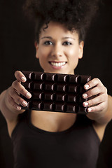 Image showing Woman with a chocolate bar