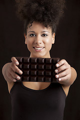 Image showing Woman with a chocolate bar