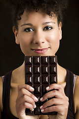 Image showing Woman with a chocolate bar