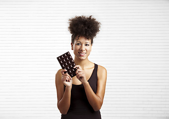 Image showing Woman with a chocolate bar