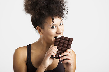 Image showing Woman eating chcolate