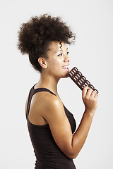 Image showing Woman eating chcolate