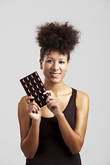 Image showing Woman with a chocolate bar