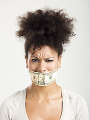 Image showing Covering mouth with a dollar banknote