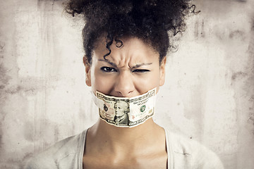 Image showing Covering mouth with a dollar banknote