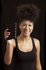 Image showing Woman with a chocolate bar