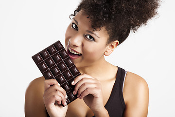 Image showing Woman eating chcolate