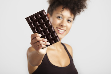 Image showing Woman with a chocolate bar