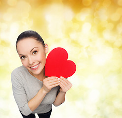 Image showing smiling asian woman with red heart