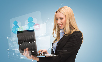 Image showing smiling woman with laptop computer