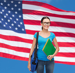 Image showing smiling student with bag and folders