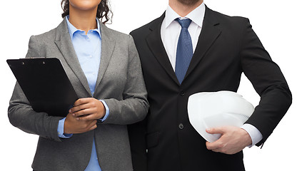 Image showing businesspeople with clipboard and helmet