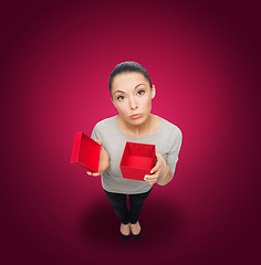 Image showing disappointed asian woman with empty red gift box
