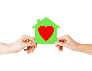 Image showing couple hands holding green paper house